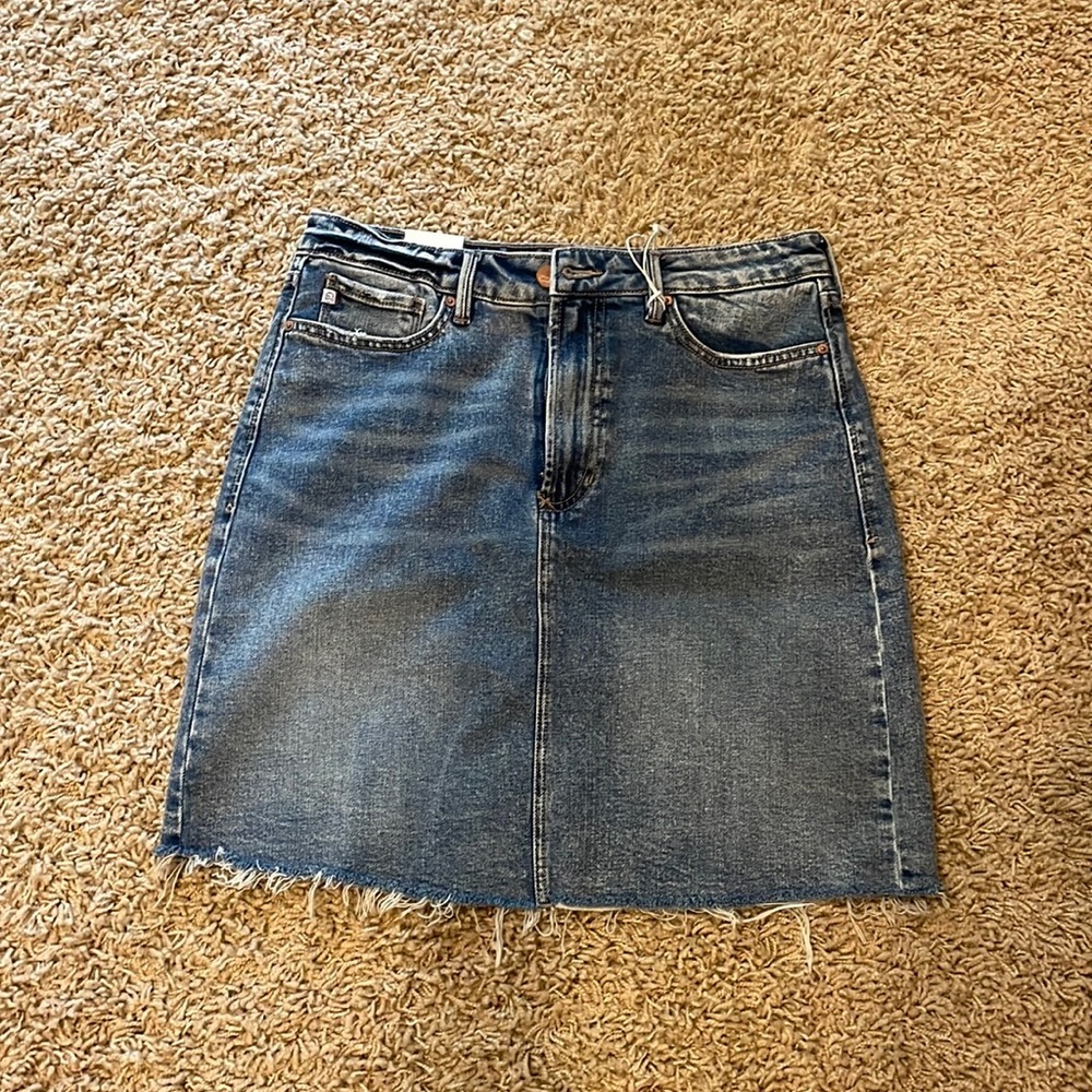 Jean skirt with distressed edges. NWT